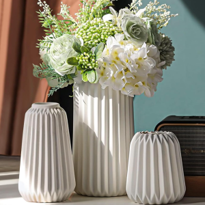 Three-Piece Set of Matte White Ceramic Vases with Vertical Ribbed Texture